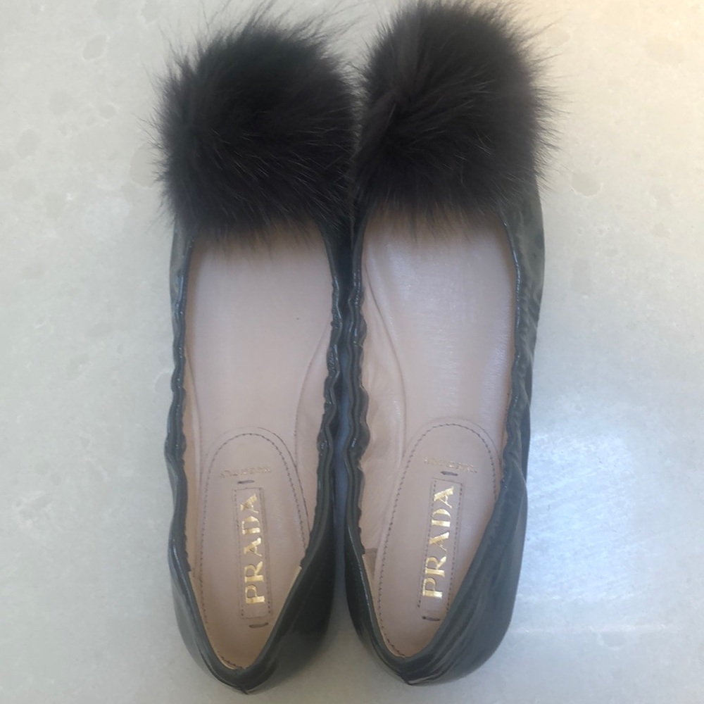PRADA slate grey patent flats with a “fuzz ball”
